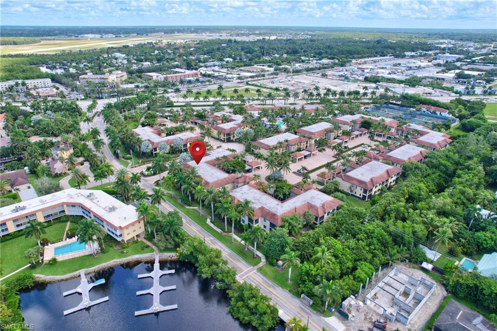 Birds eye view of property featuring a water view
