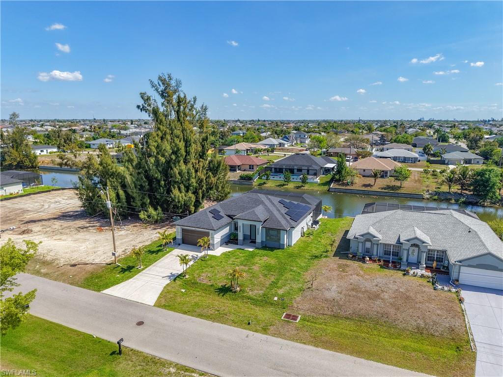 Aerial perspective of suburban area with a large body of water