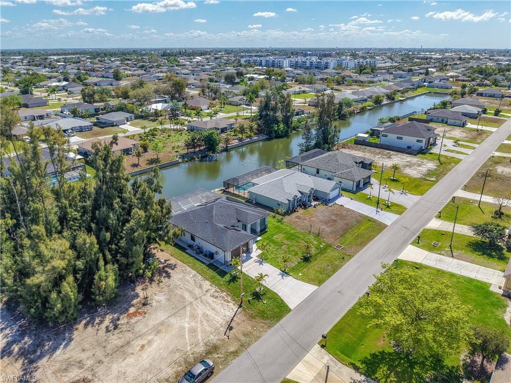 Aerial view of residential area with a nearby body of water