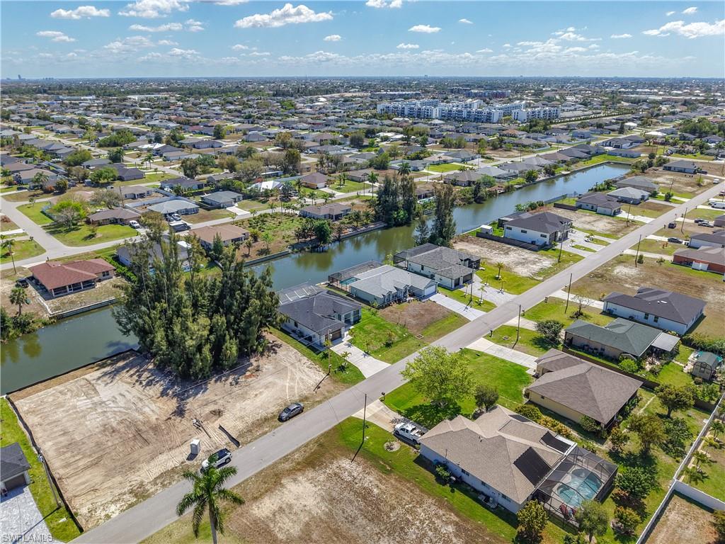 Aerial view of residential area with a nearby body of water
