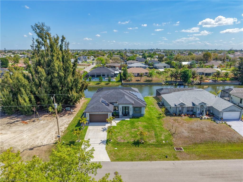 Aerial view of residential area with a large body of water