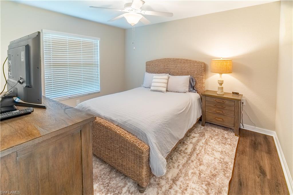 Bedroom with light hardwood / wood-style flooring and ceiling fan