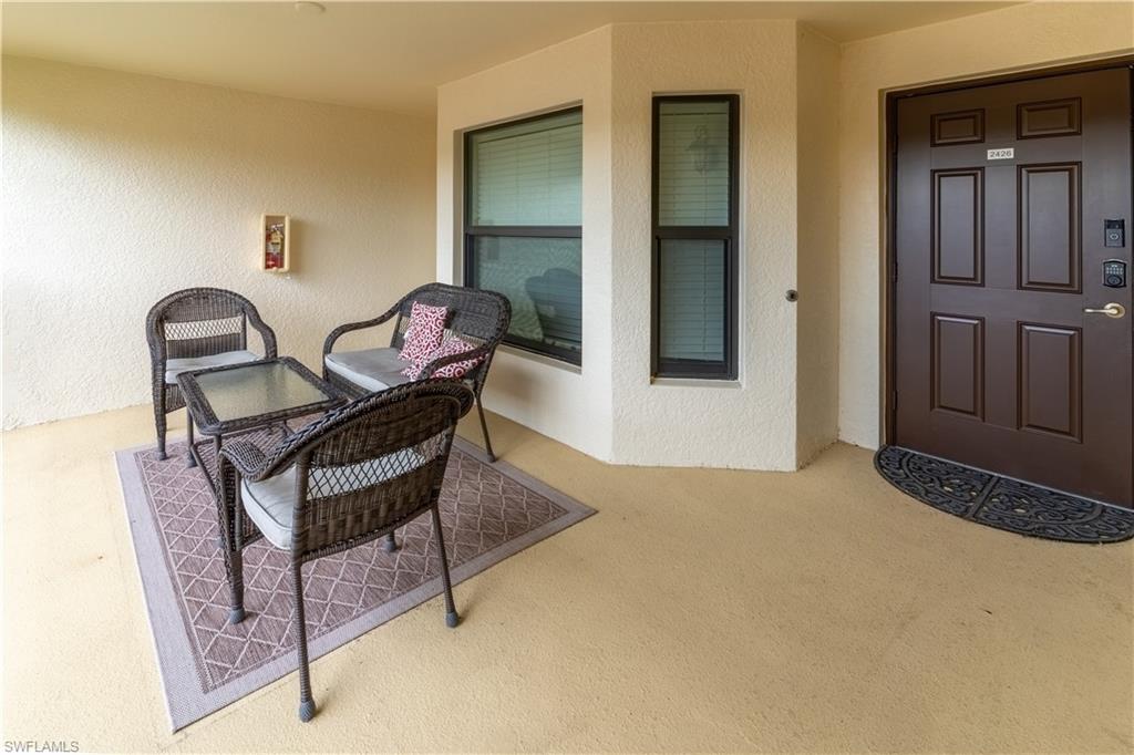 Property entrance with a patio