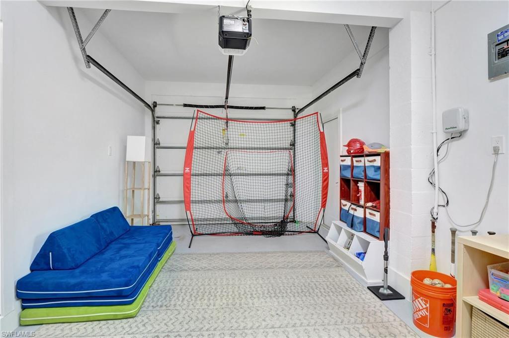 Garage featuring a garage door opener