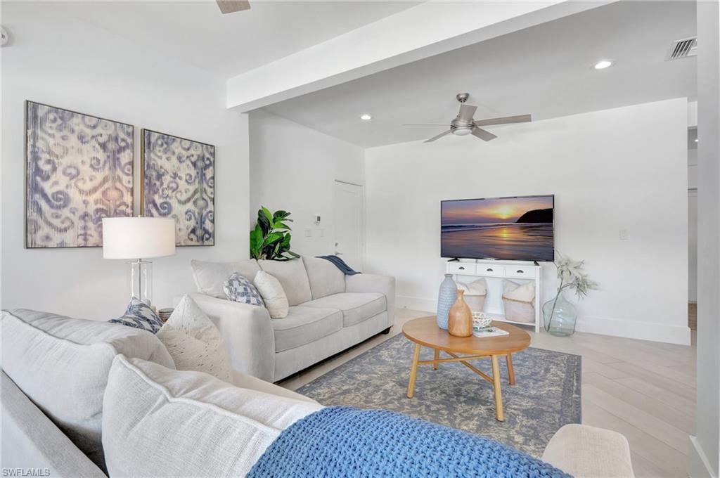Living area featuring ceiling fan and recessed lighting