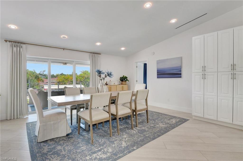 Dining space featuring vaulted ceiling, recessed lighting, and light wood finished floors
