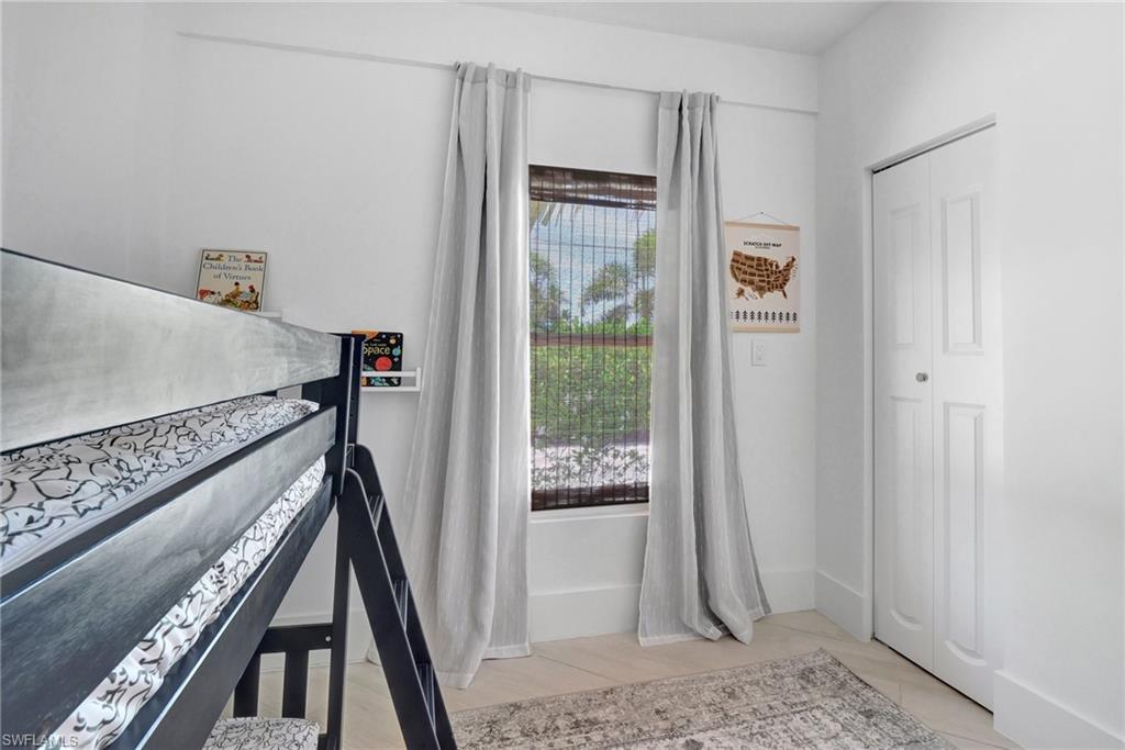 Bedroom with a closet and baseboards
