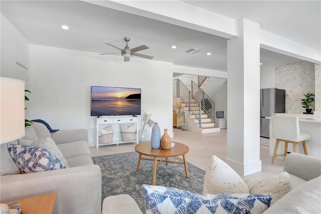 Living area with ceiling fan and recessed lighting