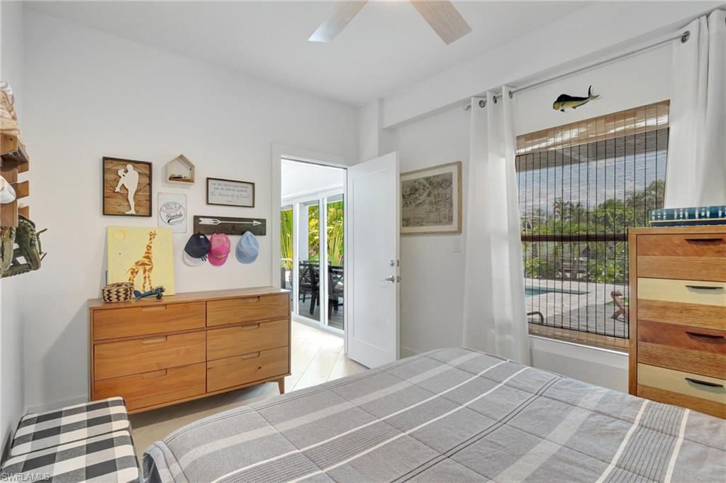 Bedroom featuring a ceiling fan and access to exterior