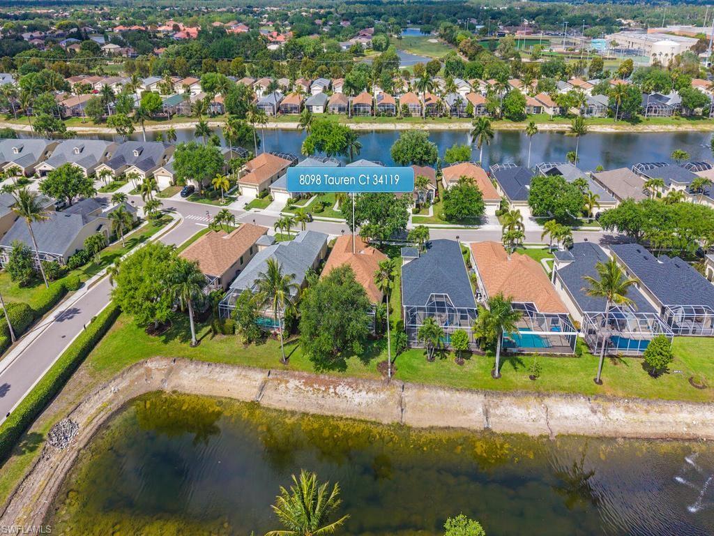 Aerial perspective showcasing a residential community with water features