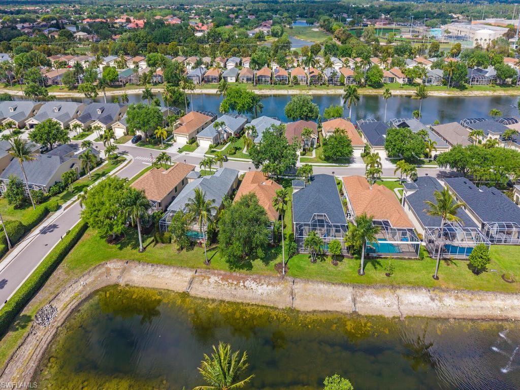 Aerial perspective showcasing a residential community with water features