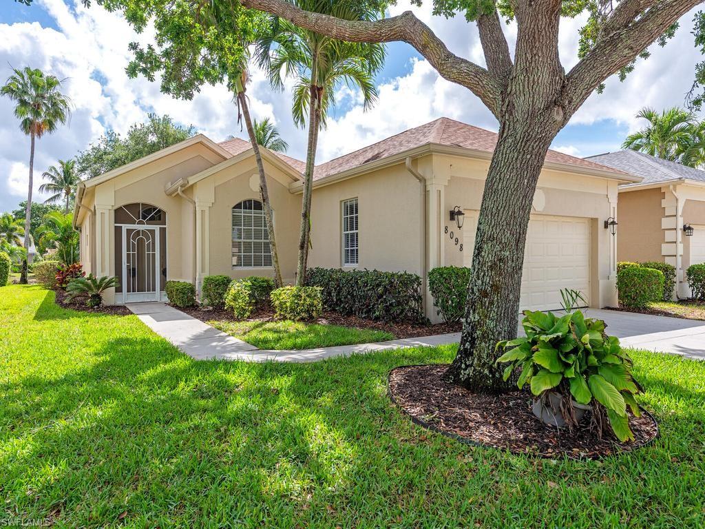 Single-story residence featuring a stucco exterior and an attached garage with a white door