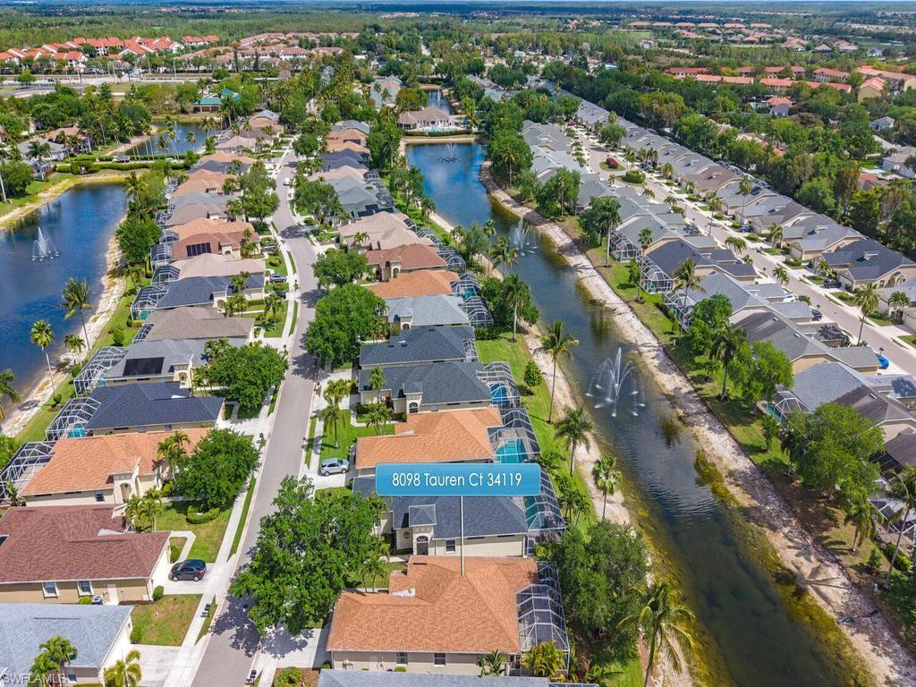 Aerial perspective showcasing a residential community with water features
