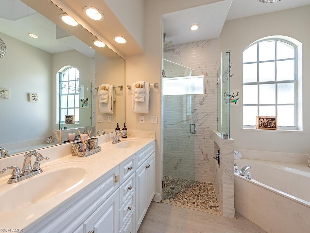 Dual vanity with white cabinetry and chrome fixtures