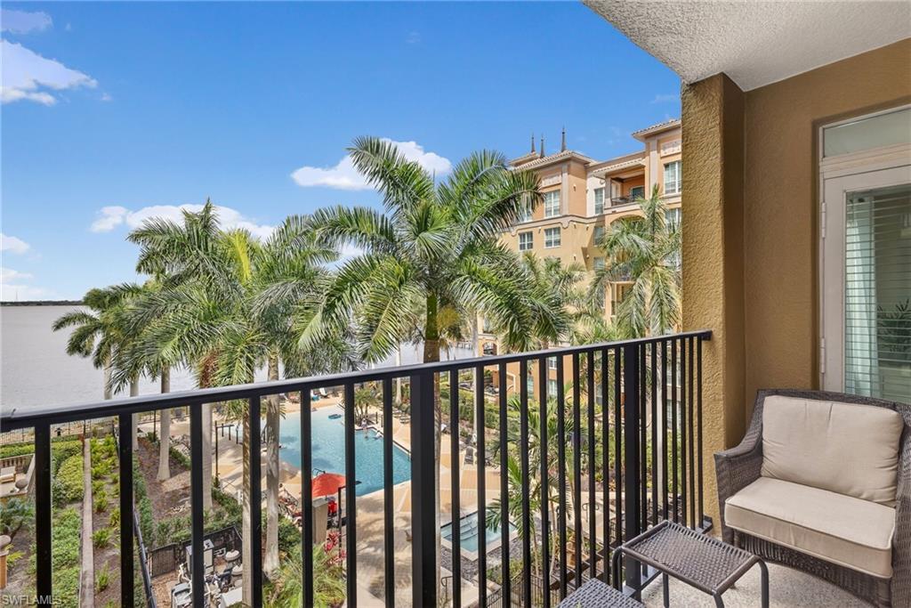 Balcony featuring view of pool