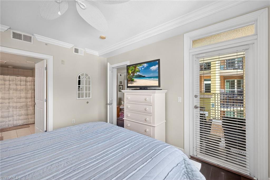 Bedroom featuring ornamental molding, access to outside, and a ceiling fan