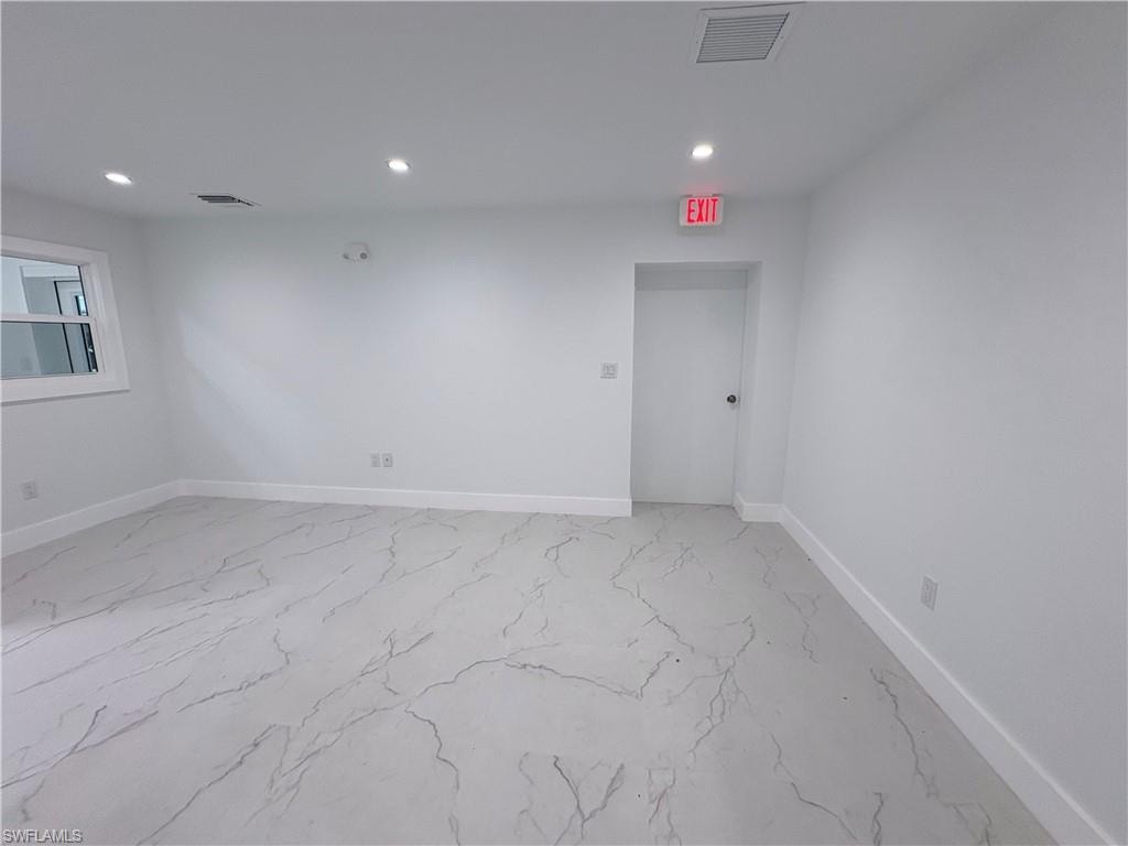 Spare room with recessed lighting