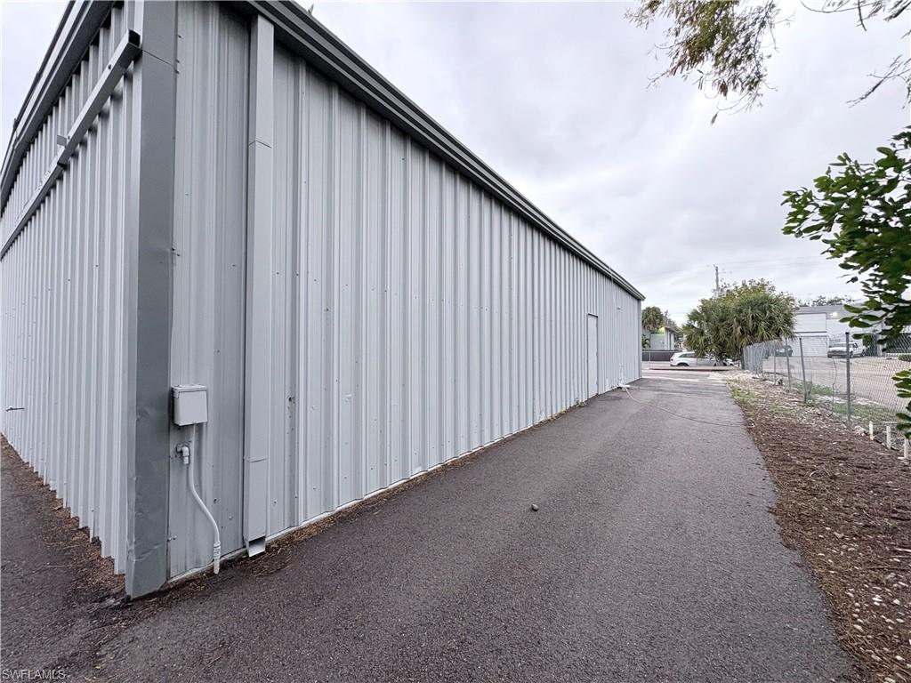 View of property exterior featuring an outdoor structure