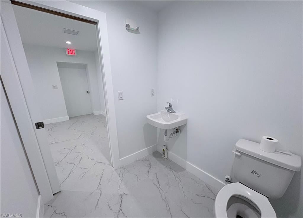 Bathroom featuring toilet and recessed lighting