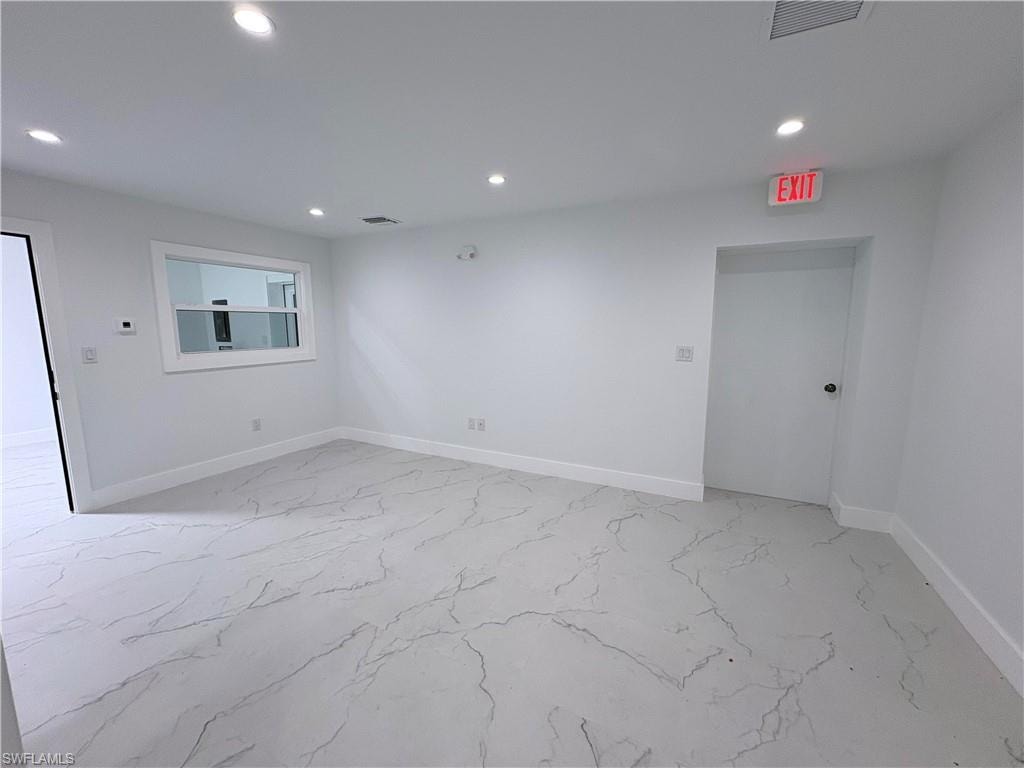 Spare room featuring recessed lighting