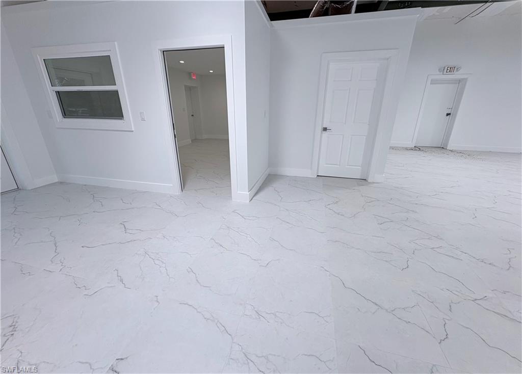 Unfurnished room with baseboards