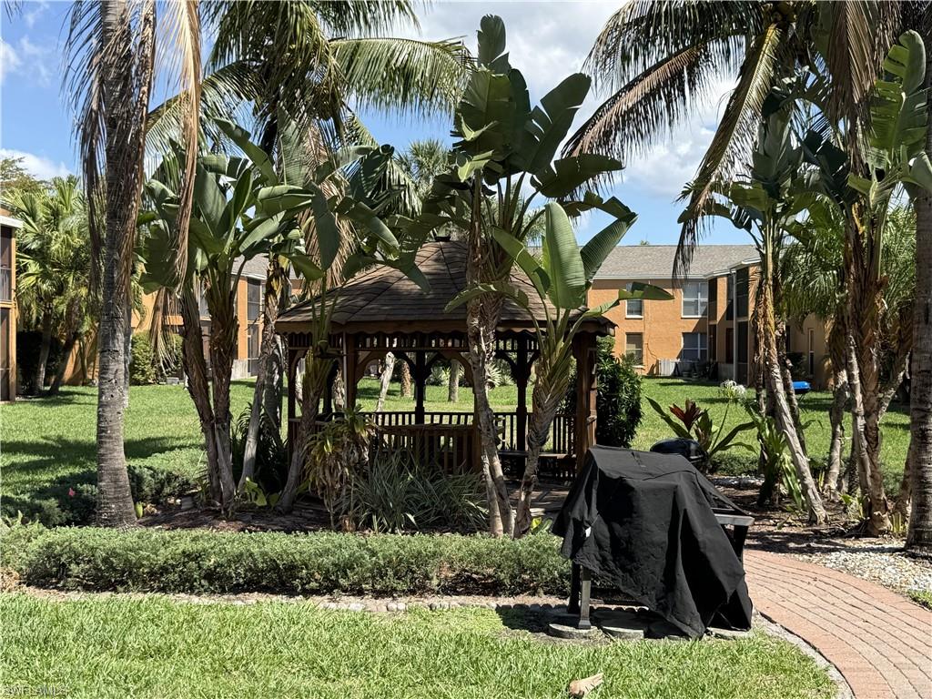 View of green lawn featuring a gazebo