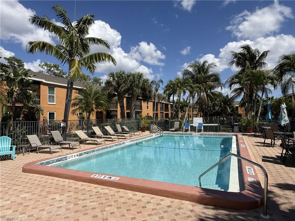 Community pool with a patio area