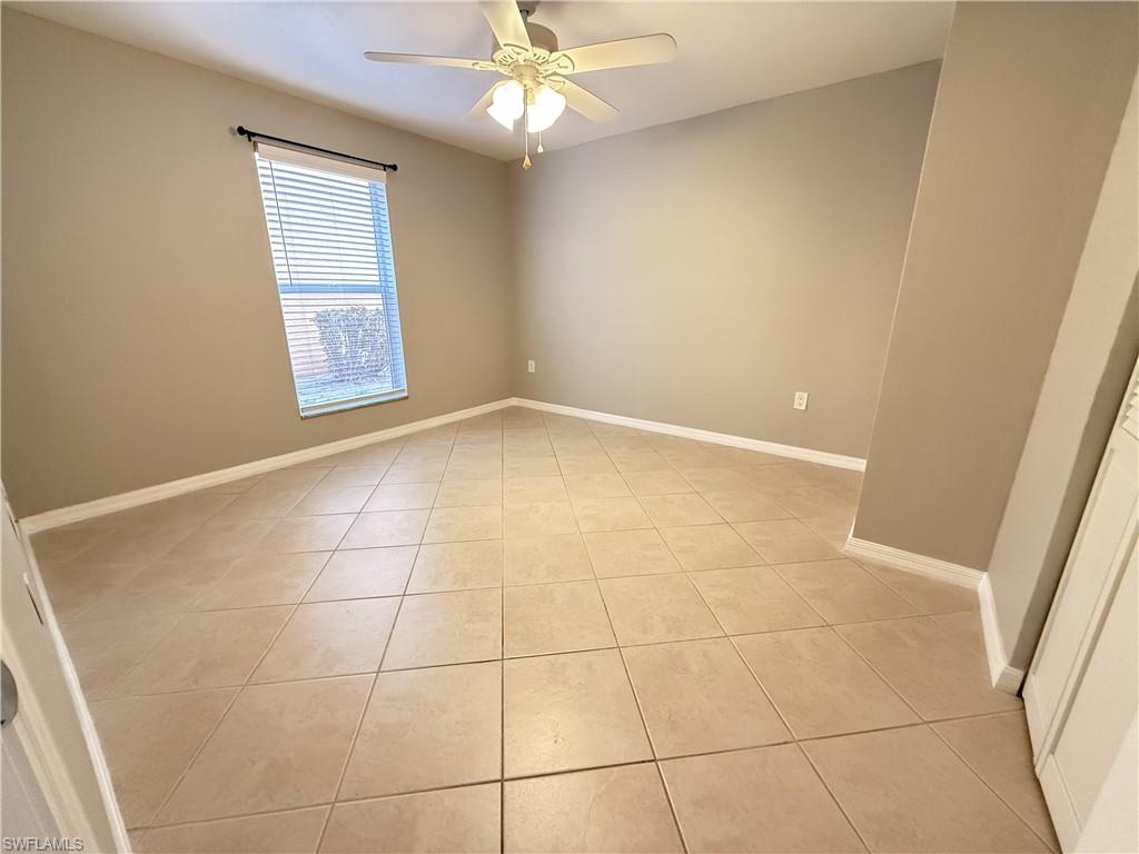 2nd Bedroom featuring light tile patterned floors and a ceiling fan