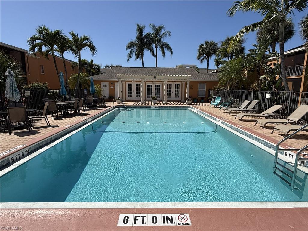 Community pool with a patio area