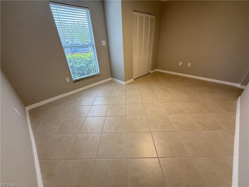 Unfurnished 3rd bedroom featuring a closet and light tile patterned flooring
