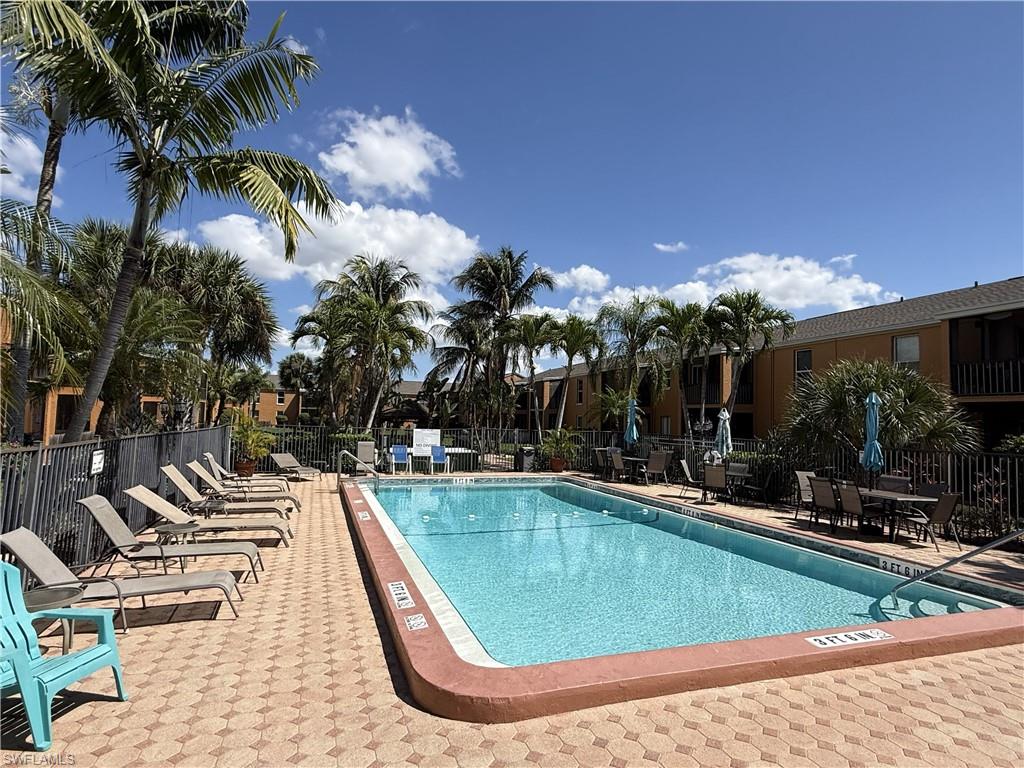 Community pool with a patio