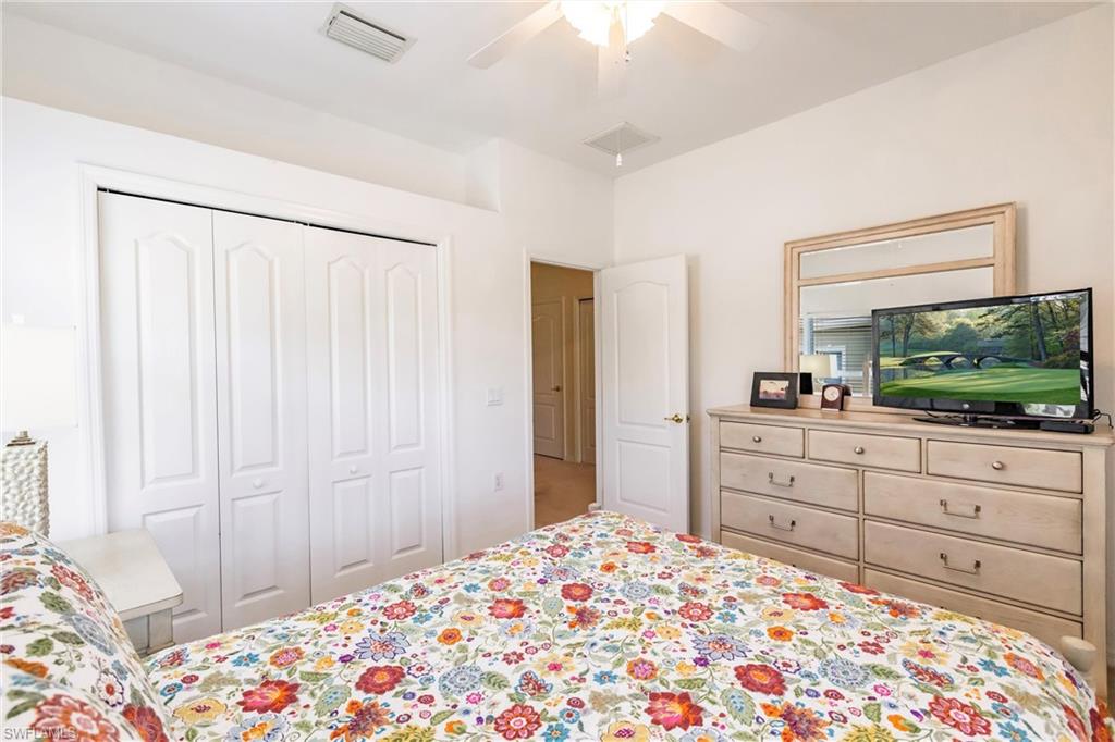 Bedroom featuring ceiling fan and a closet