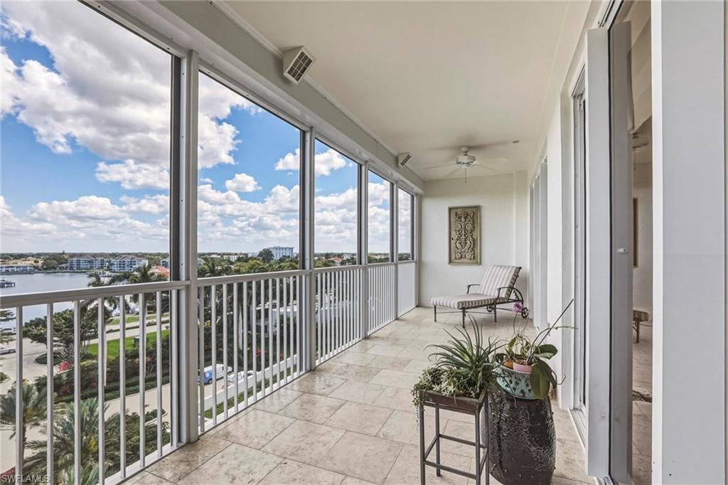 Lanai featuring a balcony and a ceiling fan