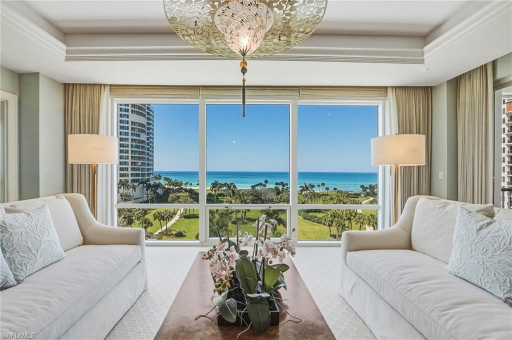 Living area featuring a Gulf view and a raised ceiling