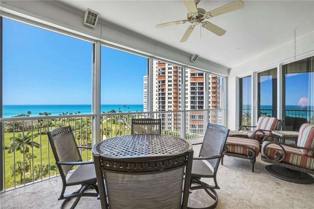 Lanai featuring a water view and ceiling fan