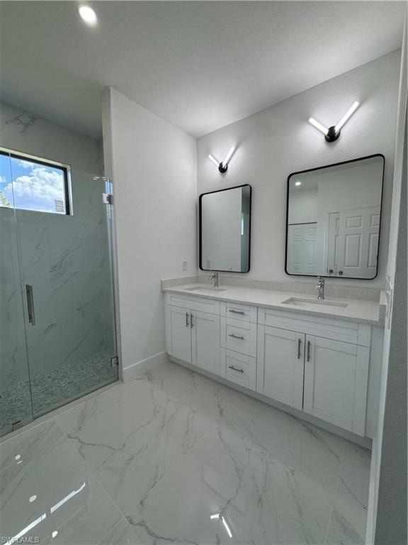 Full bathroom featuring double vanity, light marble finish flooring, a marble finish shower, and recessed lighting