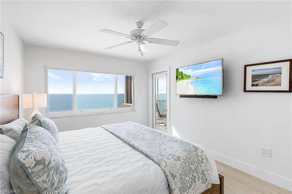 Primary bedroom with king bed, impact windows and door to lanai.