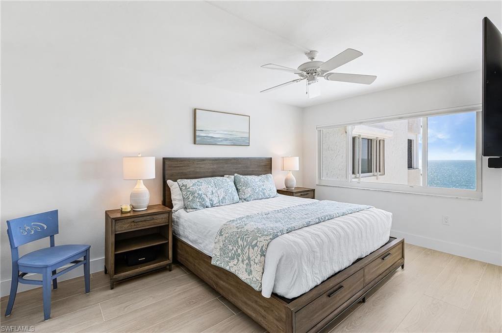 Primary bedroom with King sized bed (extra storage in bed) with impact window and impact door to lanai.