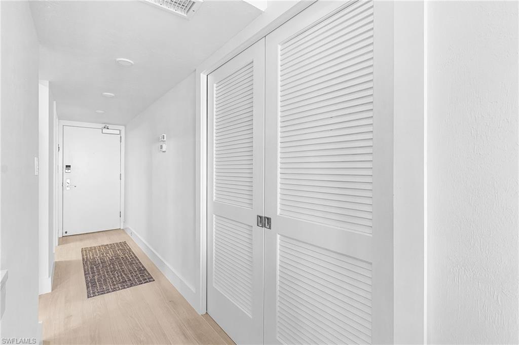 This photo shows hallway to guest bedroom and bath with pocket doors closed for privacy for your guests.