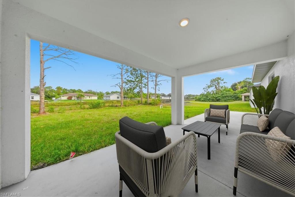 View of patio with an outdoor lounge area and a residential view