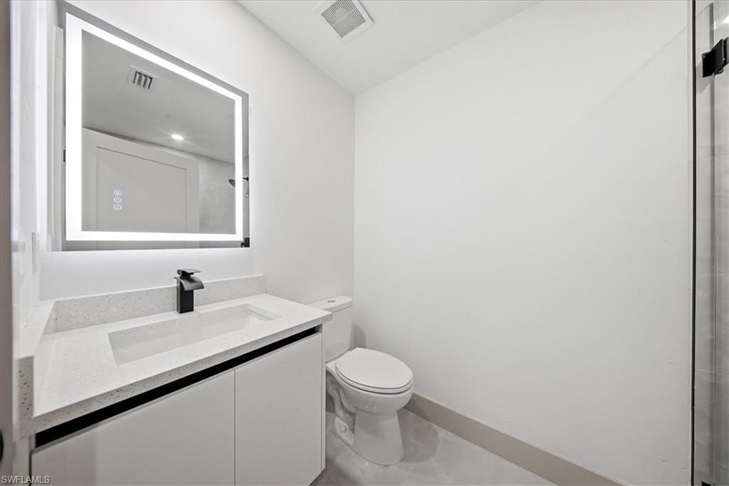 Bathroom featuring toilet and vanity