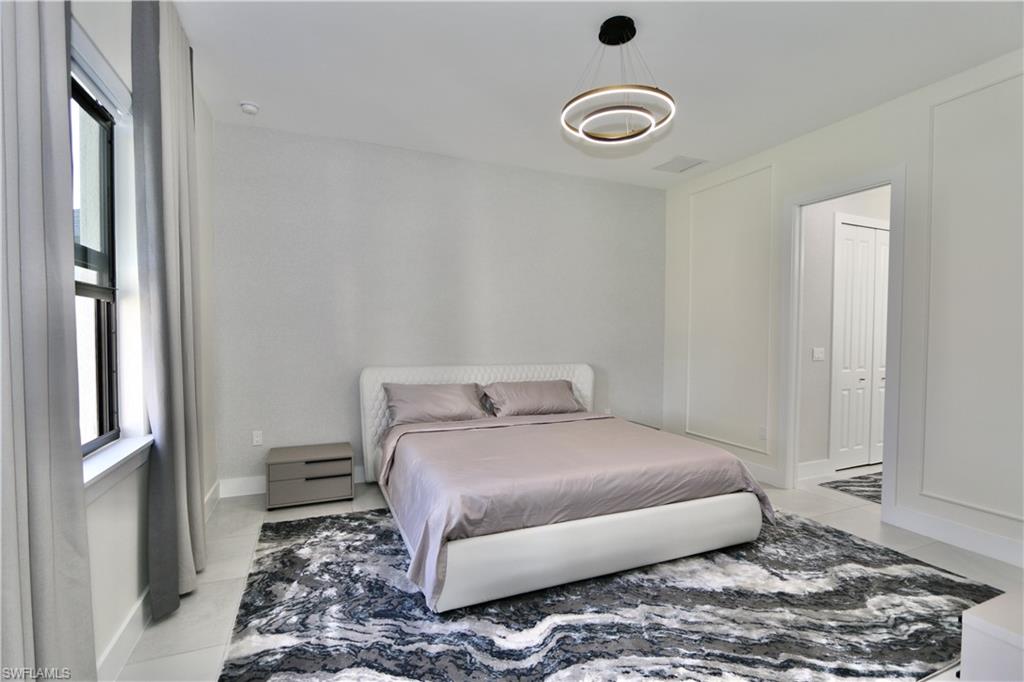 Bedroom featuring light tile patterned flooring