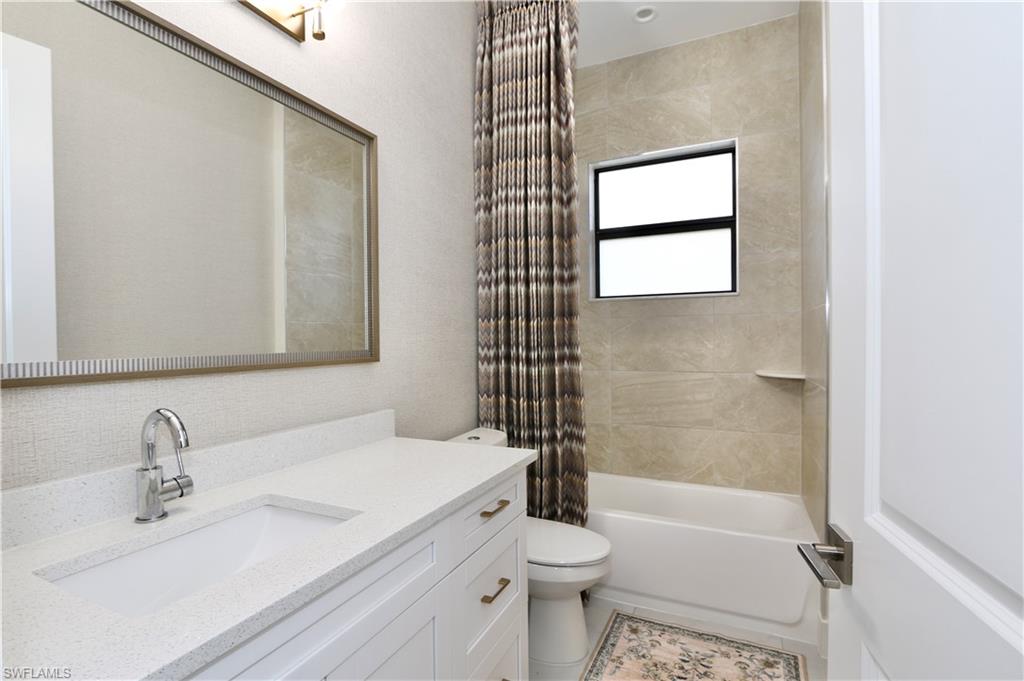 Full bathroom featuring vanity and shower / tub combo