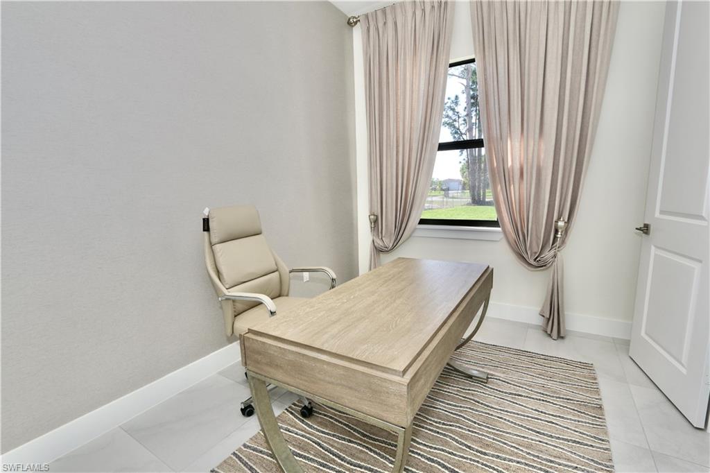 Office area featuring baseboards