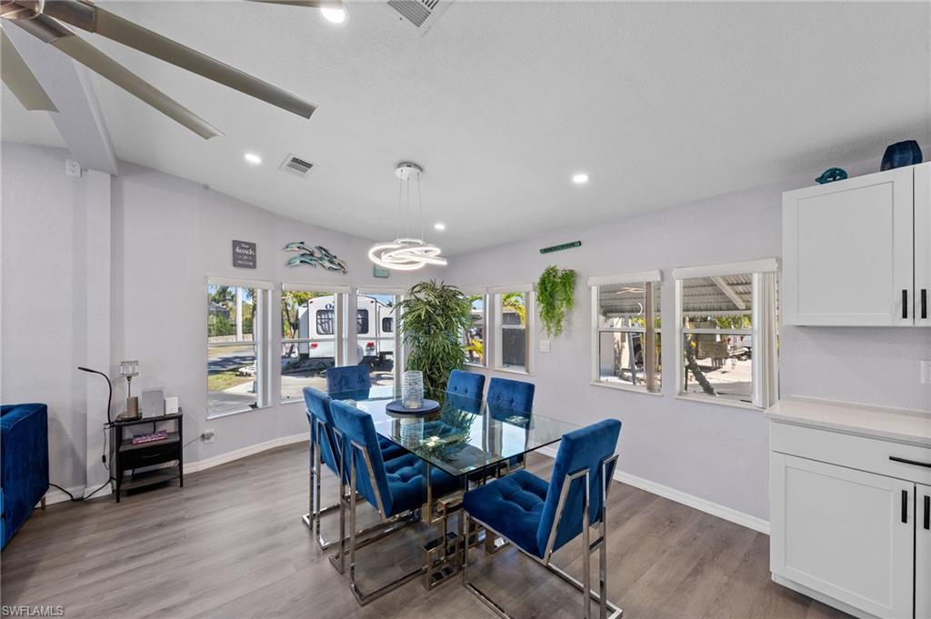 Dining area featuring wood finished floors and recessed lighting
