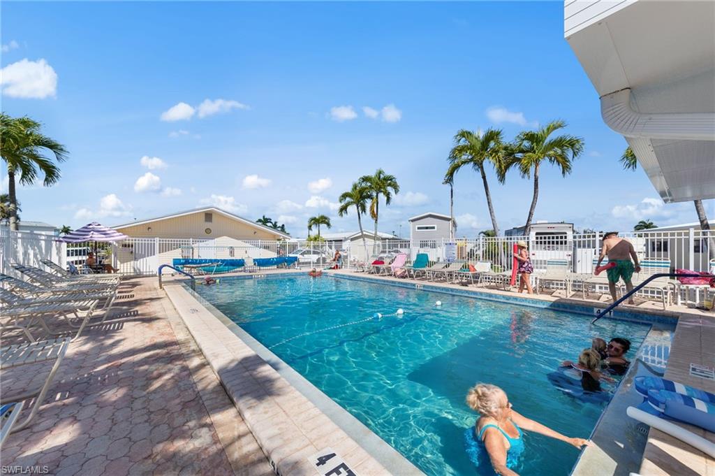 Community pool featuring a patio area