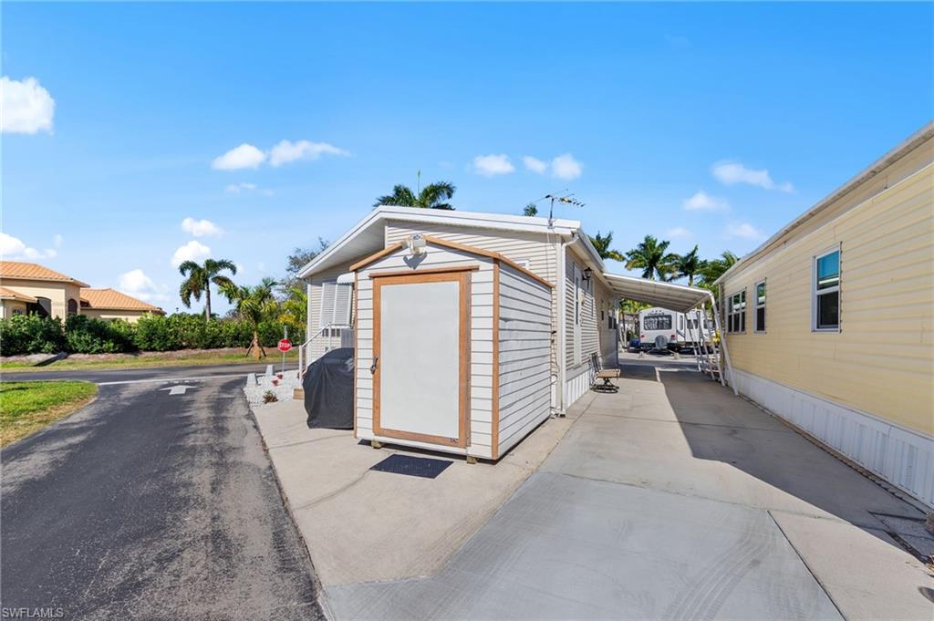 Garage featuring a storage shed
