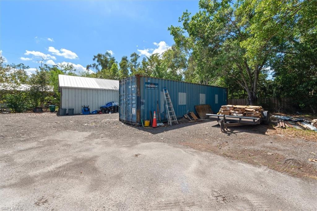 View of property with an outbuilding