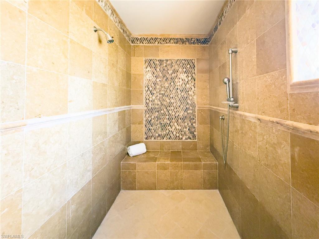 Bathroom featuring tiled shower