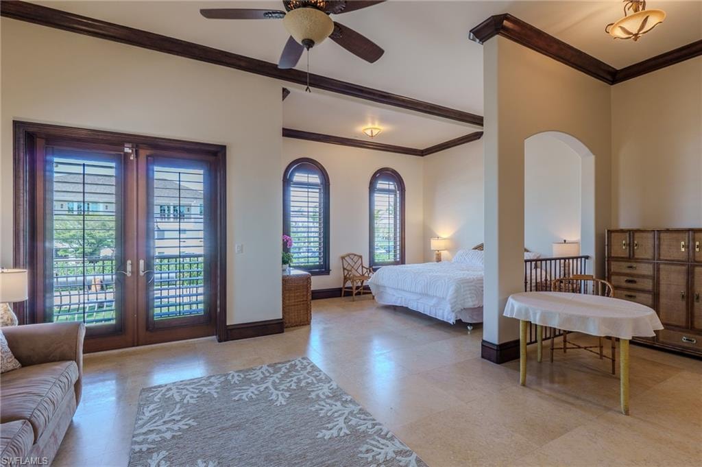 Bedroom with crown molding, access to outside, and french doors